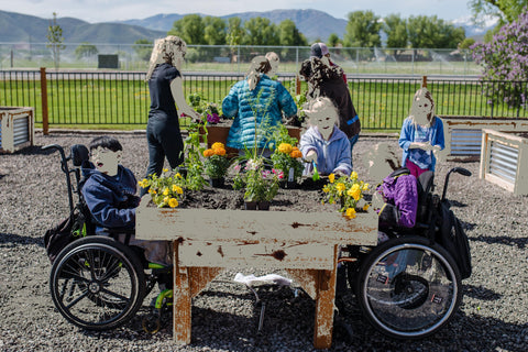 Ada Wheelchair accessible garden in use by school-age handicap children